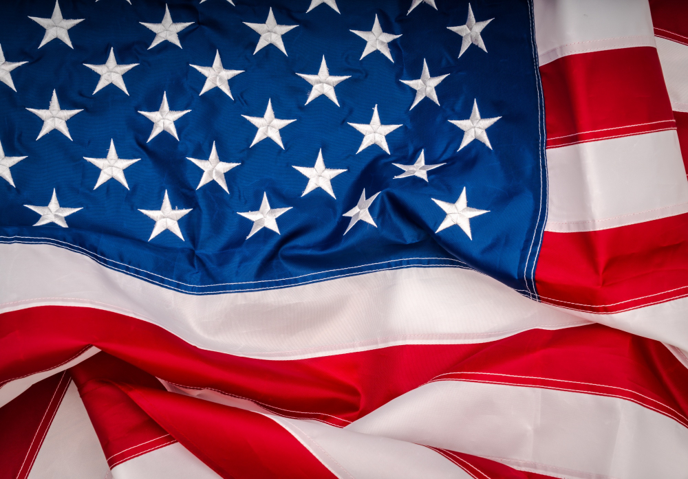 Embroidered American flag in dramatic lighting